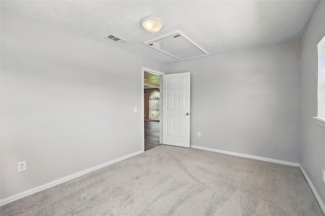 1118 Hammock St, Houston, TX 77009 - empty room featuring attic access, carpet flooring, and baseboards