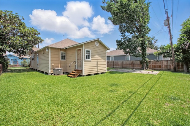 1118 Hammock St, Houston, TX 77009 - rear view of house with entry steps, cooling unit, and a shingled roof