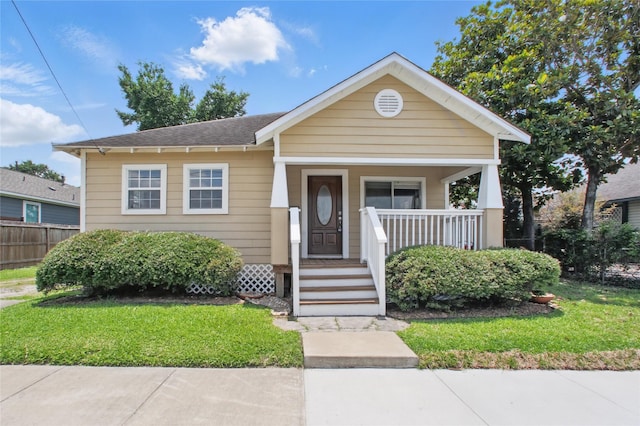 1118 Hammock St, Houston, TX 77009 - view of front of property featuring covered porch and a shingled roof
