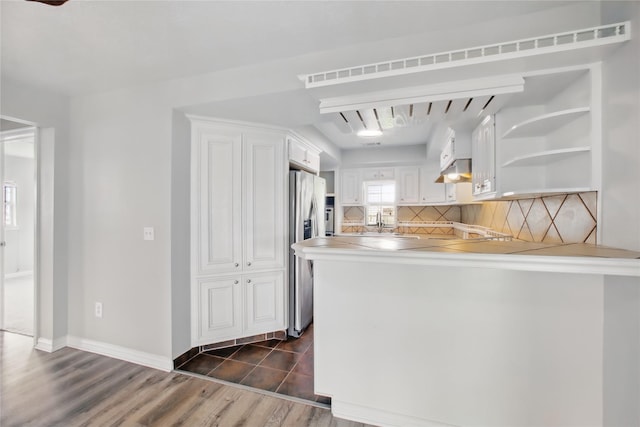 1118 Hammock St, Houston, TX 77009 - kitchen with stainless steel fridge with ice dispenser, white cabinetry, a peninsula, tasteful backsplash, and open shelves
