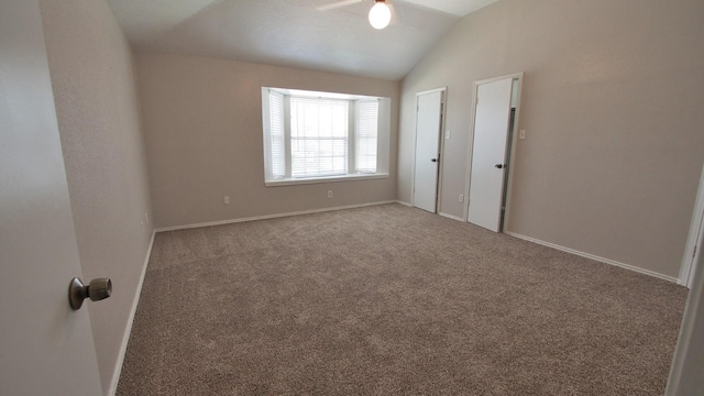 1203 Brook Grove Dr, Katy, TX 77450 - carpeted empty room with vaulted ceiling, ceiling fan, and baseboards