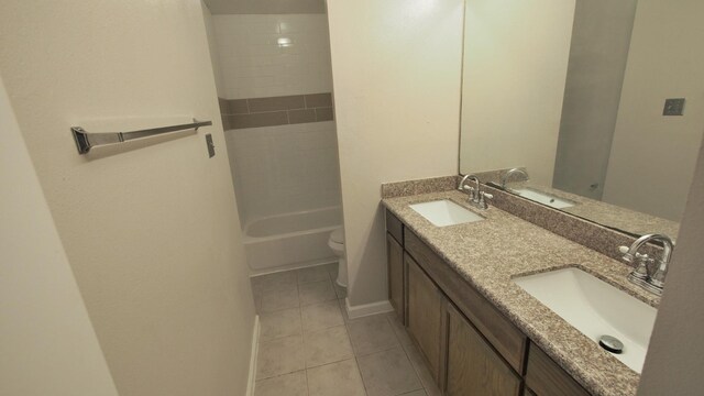 1203 Brook Grove Dr, Katy, TX 77450 - full bathroom featuring double vanity, toilet, tile patterned floors, baseboards, and bathtub / shower combination