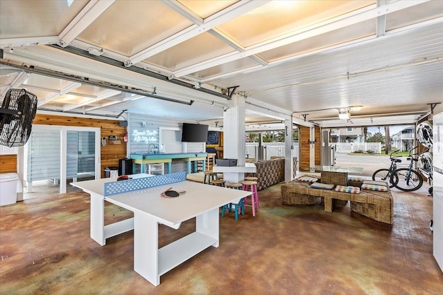 3931 Fort Bend Dr, Galveston, TX 77554 - game room featuring concrete flooring and a garage