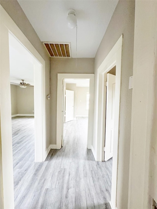 609 Martin Luther King Jr Blvd, Corsicana, TX 75110 - corridor with attic access, wood finished floors, and baseboards