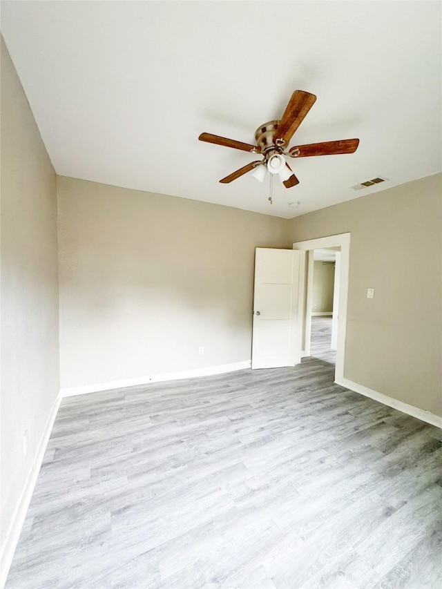 609 Martin Luther King Jr Blvd, Corsicana, TX 75110 - empty room with ceiling fan, wood finished floors, and baseboards