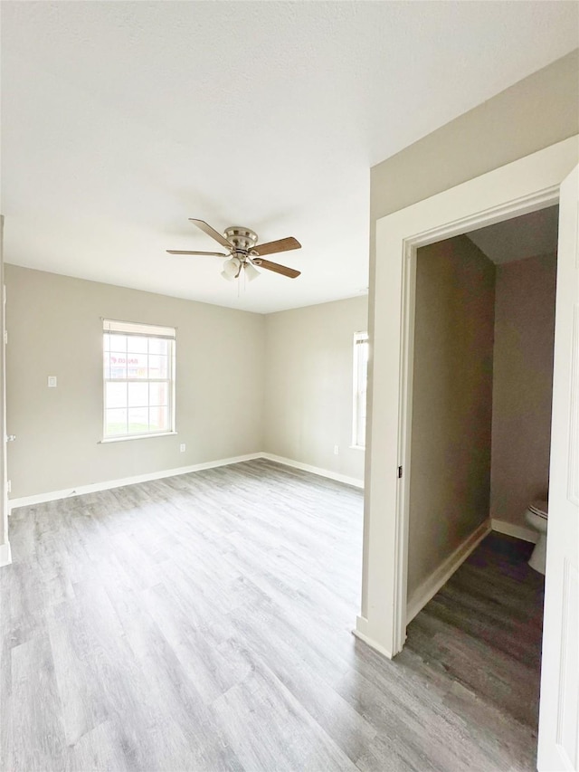 609 Martin Luther King Jr Blvd, Corsicana, TX 75110 - spare room featuring wood finished floors, ceiling fan, and baseboards