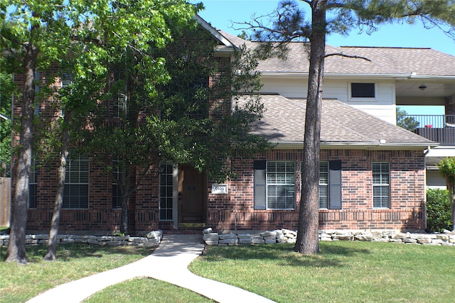 2406 Meadow Tree Ln, Spring, TX 77388 - view of front of house featuring a shingled roof, a front lawn, and brick siding