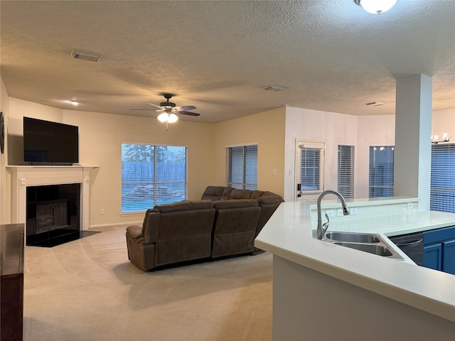 2406 Meadow Tree Ln, Spring, TX 77388 - living room with a textured ceiling, light colored carpet, a ceiling fan, and a tiled fireplace