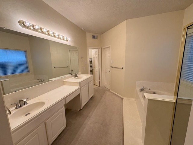 2406 Meadow Tree Ln, Spring, TX 77388 - full bathroom featuring double vanity, a textured ceiling, a bath, and baseboards