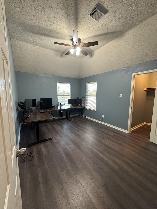 2406 Meadow Tree Ln, Spring, TX 77388 - home office featuring vaulted ceiling, wood finished floors, a textured ceiling, a ceiling fan, and baseboards