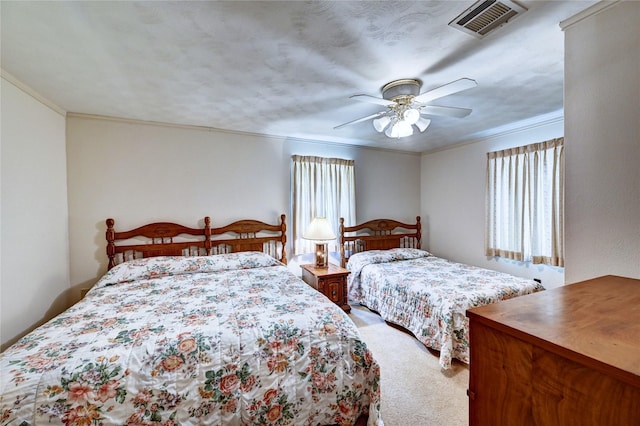 6 Hickory Holw, Huntsville, TX 77320 - bedroom featuring light colored carpet, crown molding, and a ceiling fan