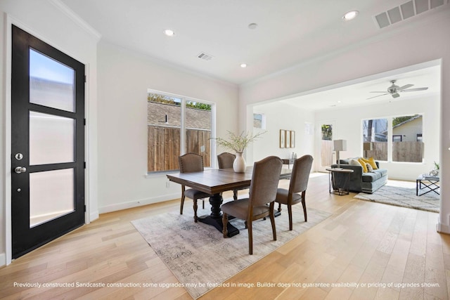 1816 Colquitt St, Houston, TX 77098 - dining area with light wood finished floors, ornamental molding, recessed lighting, baseboards, and a ceiling fan