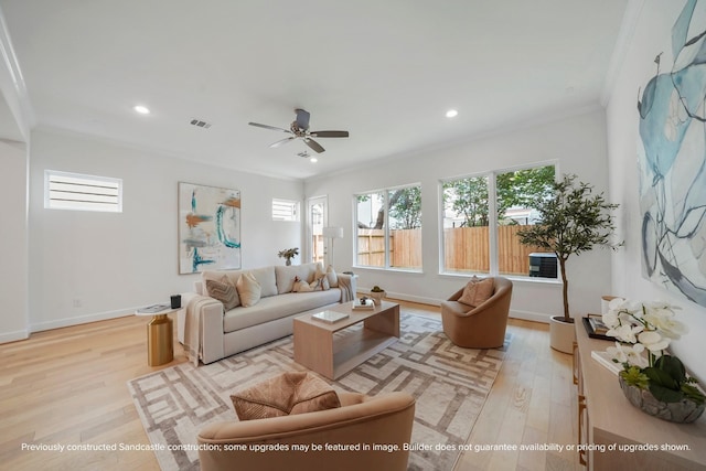 1816 Colquitt St, Houston, TX 77098 - living room with light wood finished floors, ornamental molding, recessed lighting, ceiling fan, and baseboards