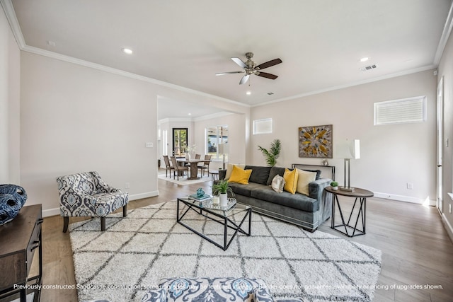 1816 Colquitt St, Houston, TX 77098 - living area with ceiling fan, baseboards, wood finished floors, recessed lighting, and crown molding