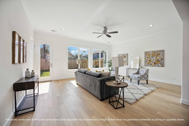 1816 Colquitt St, Houston, TX 77098 - living area featuring ceiling fan, wood finished floors, baseboards, ornamental molding, and recessed lighting