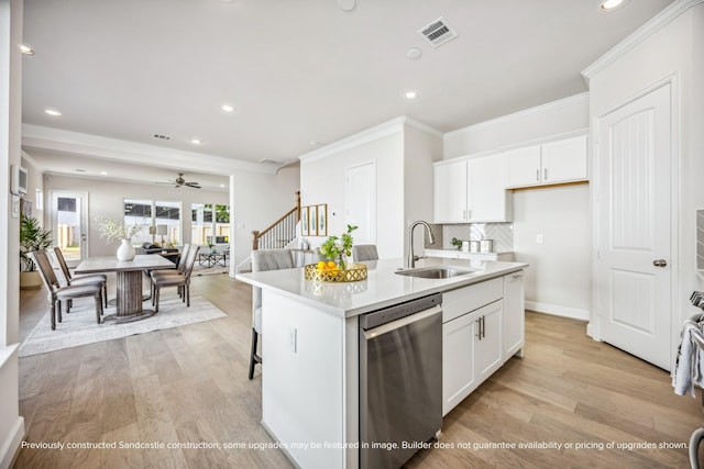 1816 Colquitt St, Houston, TX 77098 - kitchen with dishwasher, a sink, light wood-style floors, ornamental molding, and recessed lighting