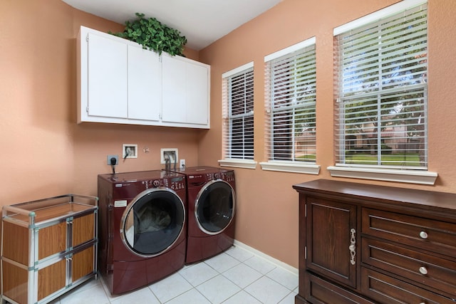 3915 Garnet Fls, Sugar Land, TX 77479 - laundry room featuring cabinet space, separate washer and dryer, light tile patterned flooring, and baseboards