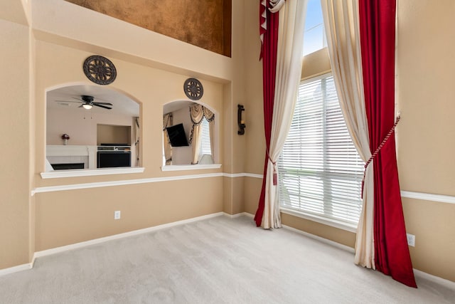3915 Garnet Fls, Sugar Land, TX 77479 - carpeted empty room featuring ceiling fan, plenty of natural light, and baseboards