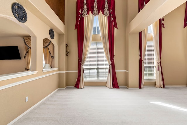 3915 Garnet Fls, Sugar Land, TX 77479 - empty room with carpet floors, arched walkways, and baseboards