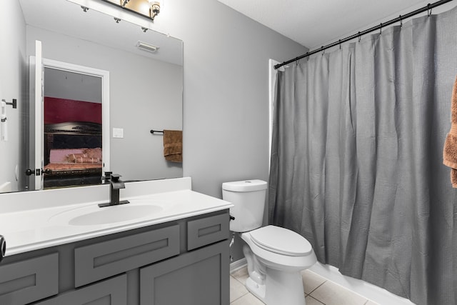3915 Garnet Fls, Sugar Land, TX 77479 - full bathroom with vanity, tile patterned flooring, toilet, ensuite bathroom, and a shower with shower curtain