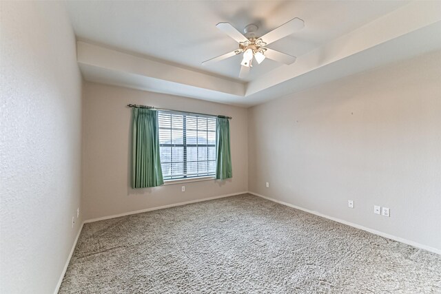404 Live Oak Ln, Friendswood, TX 77546 - unfurnished room featuring carpet, a ceiling fan, baseboards, and a tray ceiling