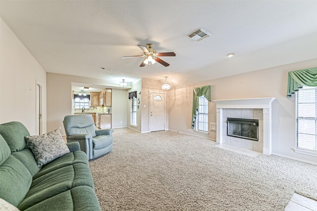 404 Live Oak Ln, Friendswood, TX 77546 - living area featuring light carpet, ceiling fan, and baseboards