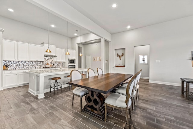 18810 Peachleaf Willow Trce, Cypress, TX 77429 - dining room with dark wood-style floors, recessed lighting, and baseboards