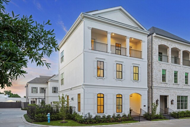 213 Sutton Row Pl, Houston, TX 77024 - view of property featuring stucco siding and a balcony