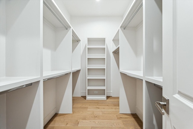 213 Sutton Row Pl, Houston, TX 77024 - spacious closet with light wood-style flooring