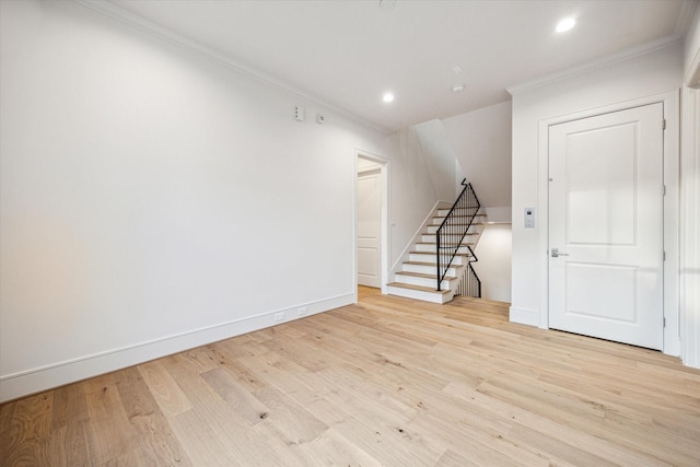 213 Sutton Row Pl, Houston, TX 77024 - spare room featuring crown molding, light wood finished floors, recessed lighting, baseboards, and stairs