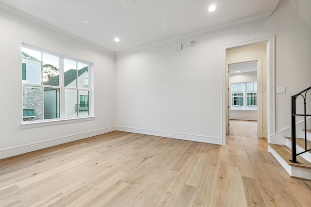 213 Sutton Row Pl, Houston, TX 77024 - spare room featuring ornamental molding, healthy amount of natural light, light wood-style floors, recessed lighting, and stairs