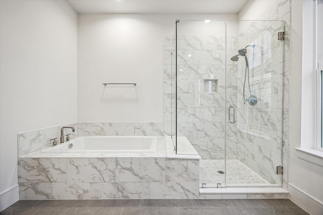 213 Sutton Row Pl, Houston, TX 77024 - full bath with a bath, a shower stall, and baseboards