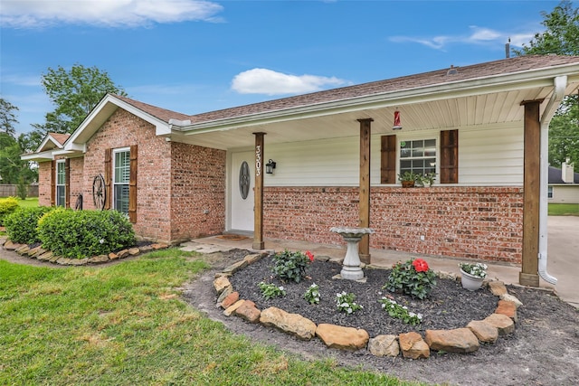 3303 Indian Mound Trl, Crosby, TX 77532 - ranch-style house with brick siding, covered porch, and roof with shingles
