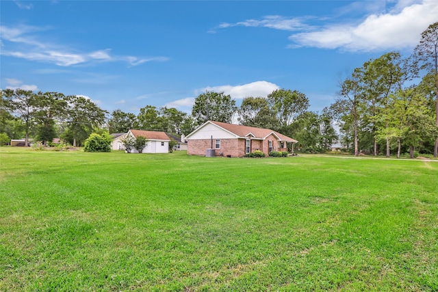 3303 Indian Mound Trl, Crosby, TX 77532 - view of grassy yard featuring central AC unit