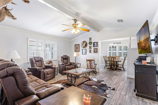 3303 Indian Mound Trl, Crosby, TX 77532 - living area featuring plenty of natural light, light wood-type flooring, a chandelier, ceiling fan, and ornamental molding
