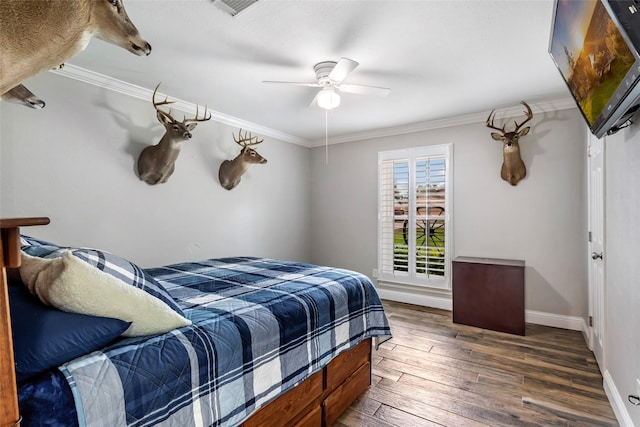 3303 Indian Mound Trl, Crosby, TX 77532 - bedroom featuring wood-type flooring, crown molding, baseboards, and a ceiling fan