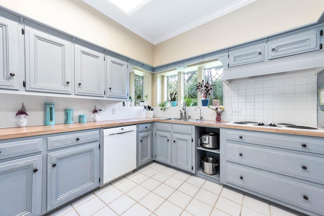 9911 Oxted Ln, Spring, TX 77379 - kitchen featuring dishwasher, a sink, ornamental molding, tasteful backsplash, and gray cabinetry