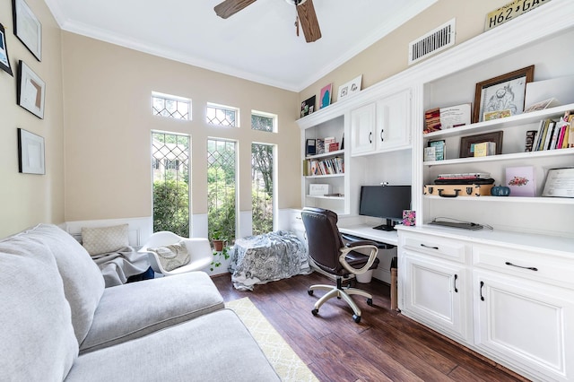9911 Oxted Ln, Spring, TX 77379 - home office featuring ceiling fan, crown molding, built in desk, and dark wood finished floors