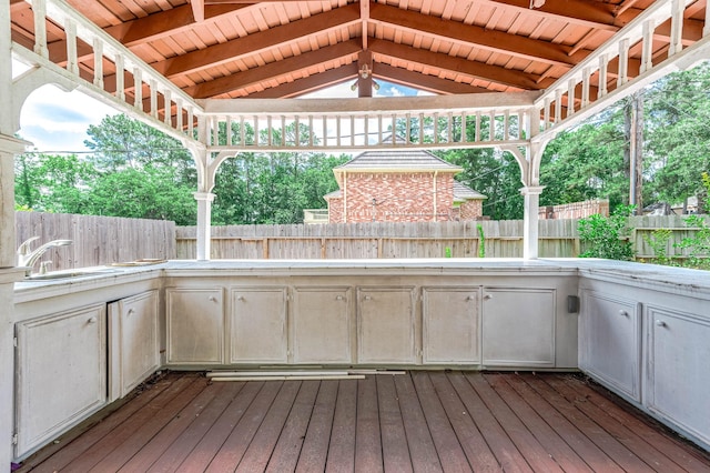 9911 Oxted Ln, Spring, TX 77379 - wooden terrace featuring a sink, area for grilling, and a fenced backyard