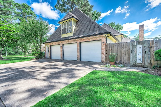 9911 Oxted Ln, Spring, TX 77379 - view of side of home featuring a garage, roof with shingles, driveway, and brick siding