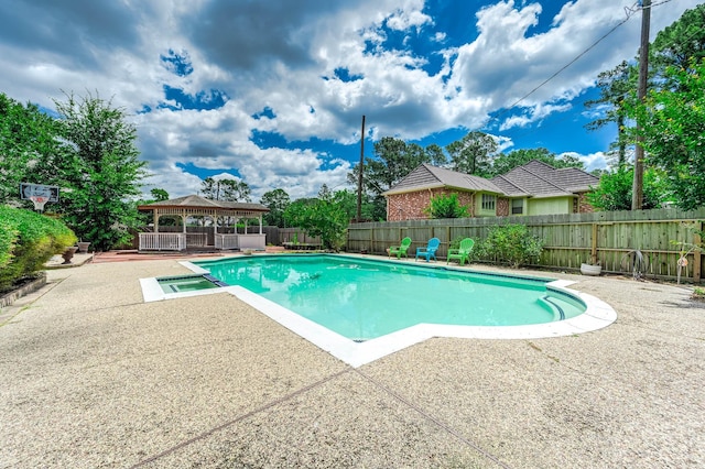 9911 Oxted Ln, Spring, TX 77379 - view of swimming pool featuring a gazebo, a patio area, a fenced backyard, and a pool with connected hot tub