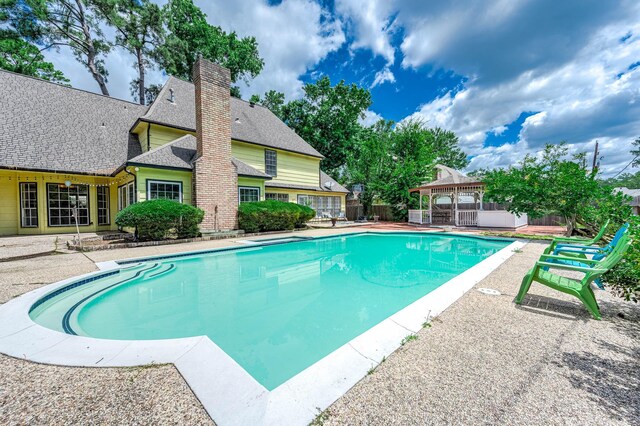9911 Oxted Ln, Spring, TX 77379 - view of swimming pool featuring a gazebo and a patio area