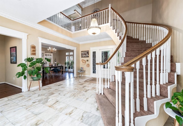 9911 Oxted Ln, Spring, TX 77379 - entrance foyer featuring a chandelier, stairway, baseboards, a towering ceiling, and crown molding