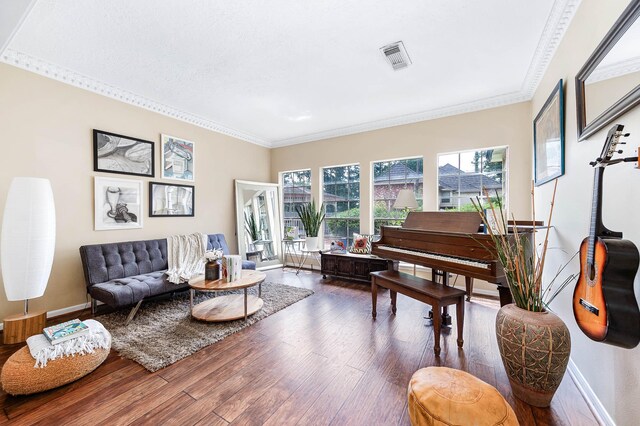 9911 Oxted Ln, Spring, TX 77379 - living room featuring wood finished floors, crown molding, and baseboards