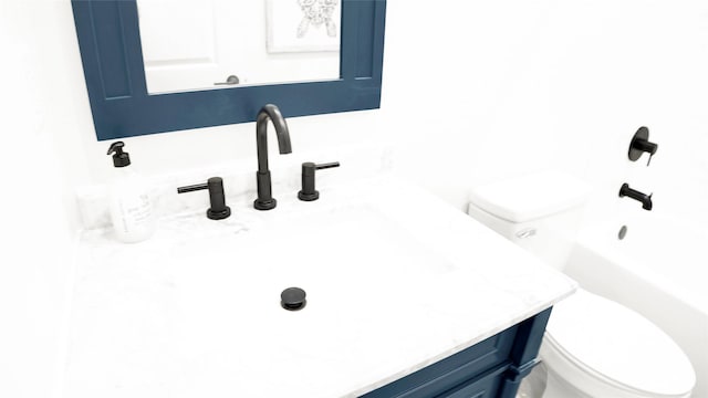 1066 Shady Ln, Gilchrist, TX 77650 - full bathroom featuring toilet, vanity, and shower / tub combination