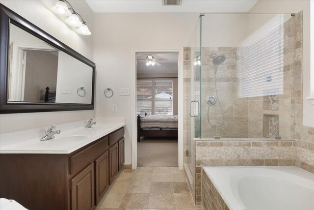 8418 Kirkbrook Dr, Houston, TX 77089 - ensuite bathroom with a stall shower, a bath, double vanity, a ceiling fan, and baseboards