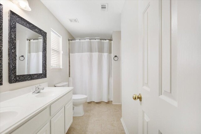 8418 Kirkbrook Dr, Houston, TX 77089 - bathroom with toilet, double vanity, tile patterned flooring, and curtained shower