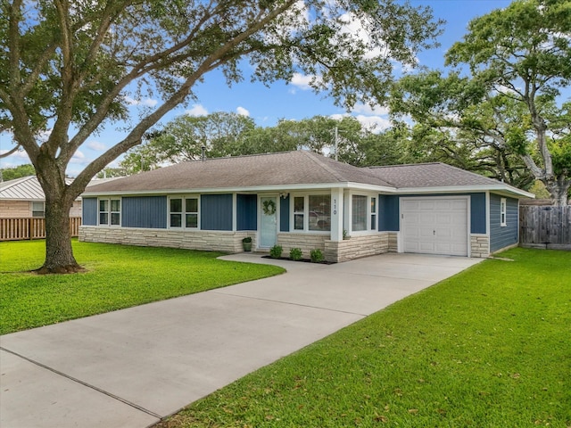 110 Marshall St, League City, TX 77573 - single story home featuring stone siding, a garage, driveway, and a shingled roof