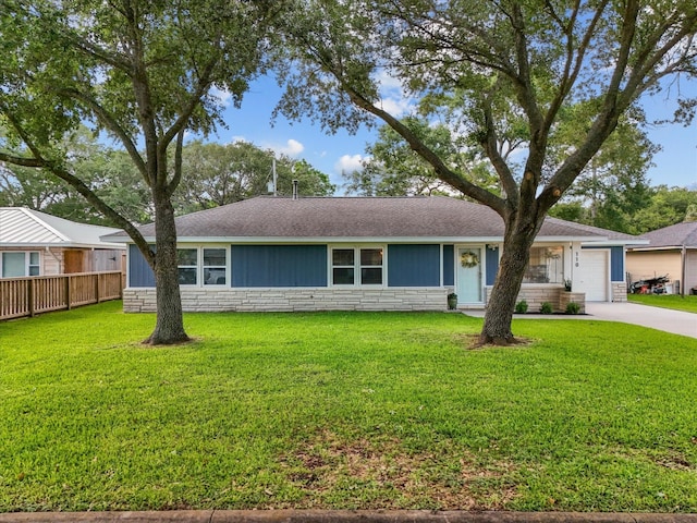 110 Marshall St, League City, TX 77573 - single story home with stone siding, driveway, a shingled roof, and a garage