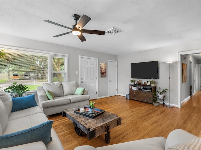 110 Marshall St, League City, TX 77573 - living area with a ceiling fan, baseboards, and light wood finished floors